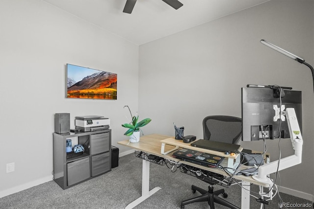 home office featuring carpet, baseboards, and a ceiling fan