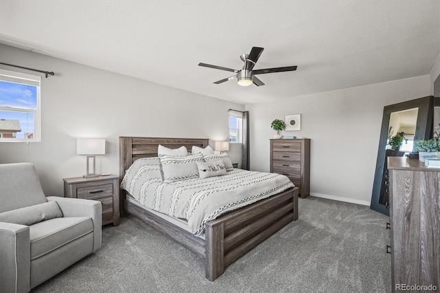 carpeted bedroom featuring baseboards and ceiling fan
