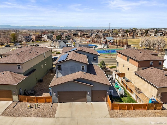 drone / aerial view featuring a mountain view and a residential view