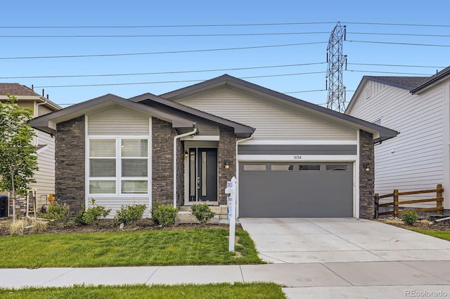 5134 Queen Ct, Arvada, CO 80002 - view of front of house featuring stone siding, concrete driveway, and a garage