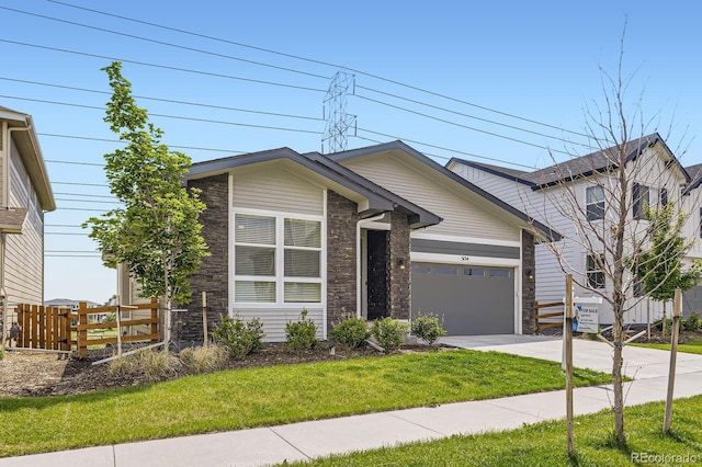 5134 Queen Ct, Arvada, CO 80002 - view of front facade with stone siding, concrete driveway, and an attached garage