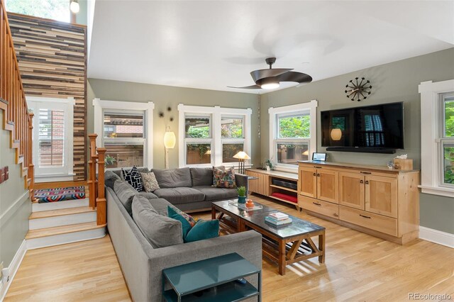 1121 S Williams St, Denver, CO 80210 - living area with stairway, light wood-type flooring, and ceiling fan