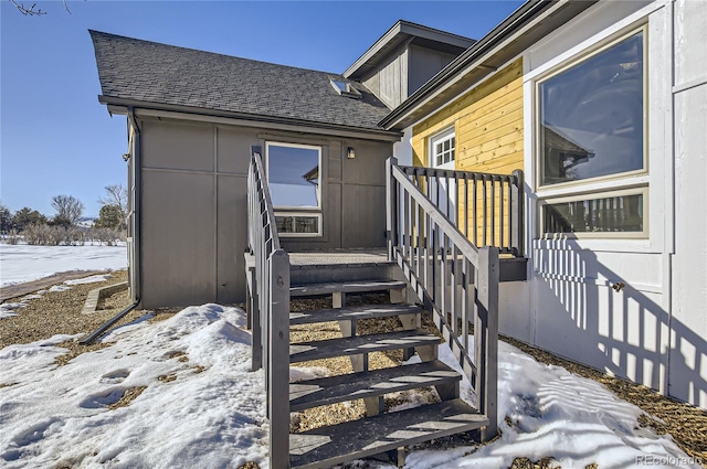 view of snow covered property entrance