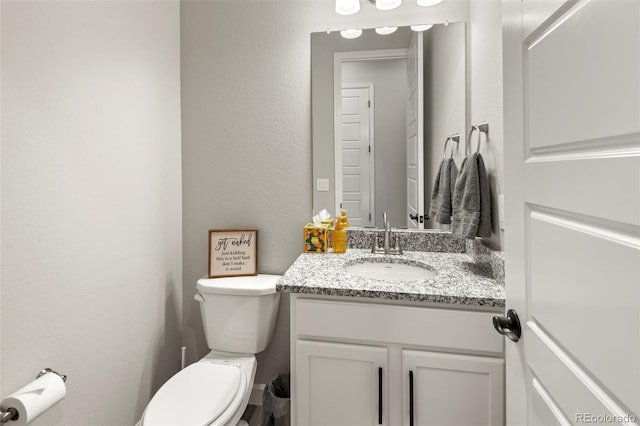 7000 S White Crow Way, Aurora, CO 80016 - half bath featuring vanity and toilet