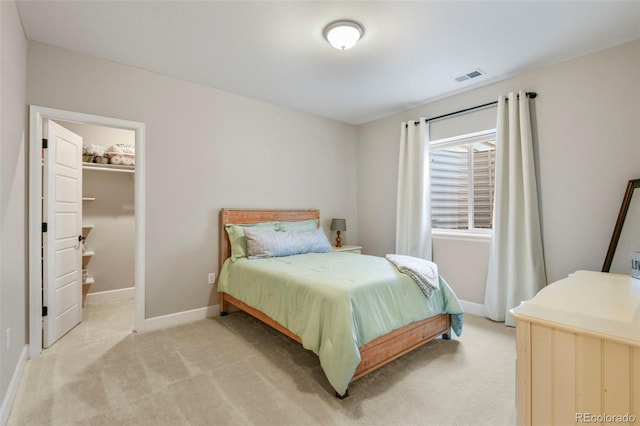 7000 S White Crow Way, Aurora, CO 80016 - bedroom with light carpet and a walk in closet