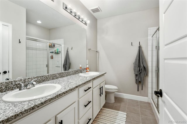 7000 S White Crow Way, Aurora, CO 80016 - bathroom featuring double vanity, a shower stall, and tile patterned floors