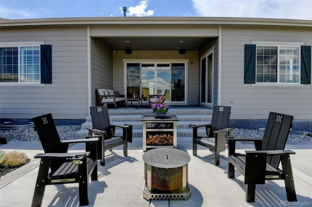 7000 S White Crow Way, Aurora, CO 80016 - view of patio with an outdoor living space with a fire pit