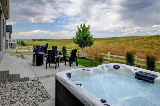 7000 S White Crow Way, Aurora, CO 80016 - view of patio featuring a hot tub and a view of countryside