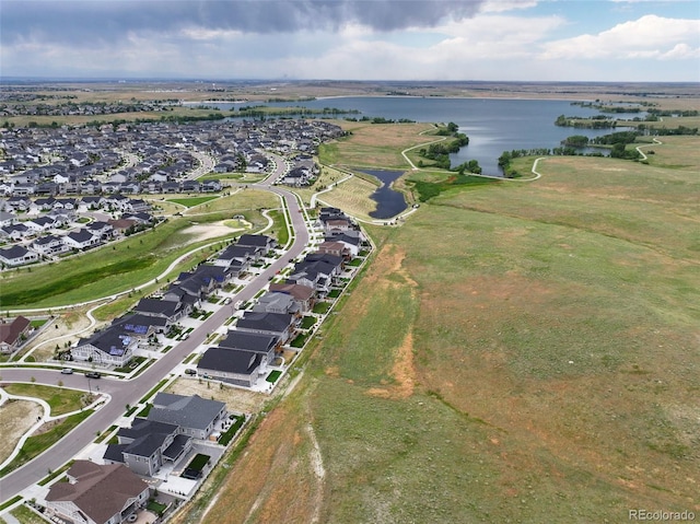 7000 S White Crow Way, Aurora, CO 80016 - aerial overview of property's location with a large body of water and nearby suburban area