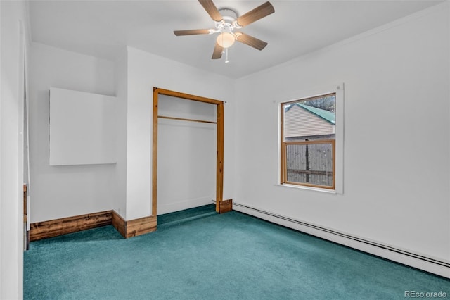 unfurnished bedroom with carpet floors, ceiling fan, a baseboard heating unit, and a closet