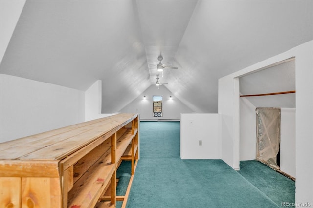 bonus room with ceiling fan, vaulted ceiling, and dark carpet