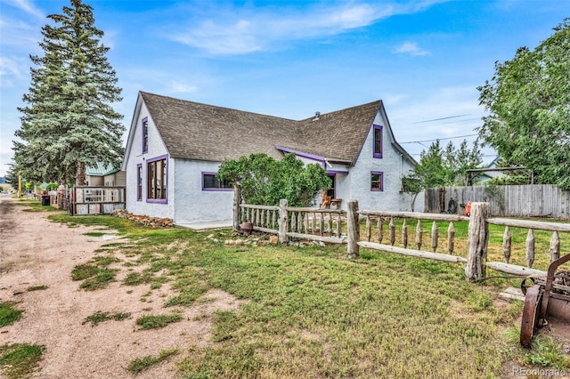 view of property exterior with a yard