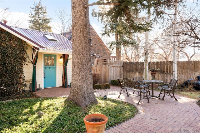 view of yard with fence and a patio