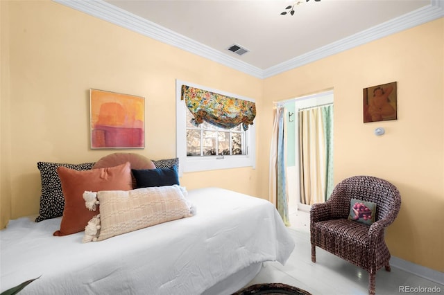 bedroom featuring ornamental molding and visible vents