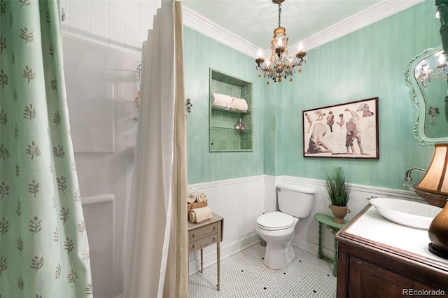 full bathroom with crown molding, a notable chandelier, toilet, wainscoting, and vanity