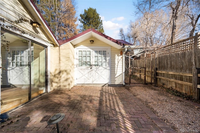 view of outbuilding with fence and an outdoor structure