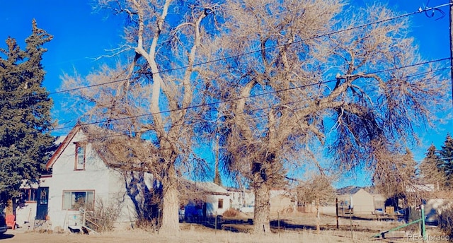 view of side of home with stucco siding
