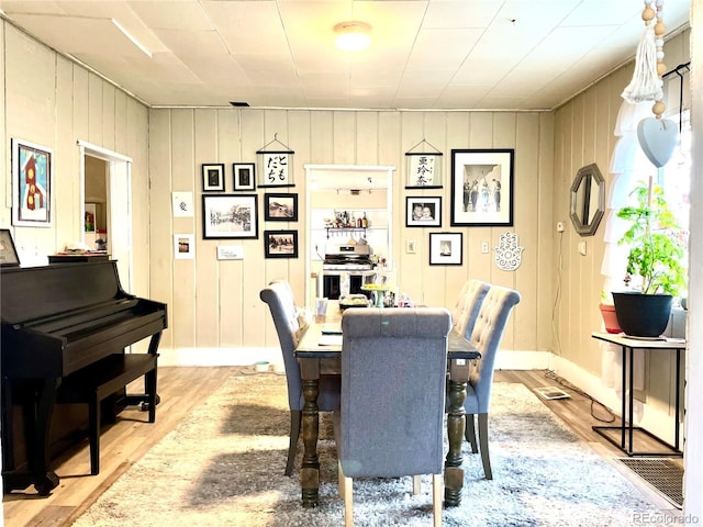 941 French St, Silver Cliff, CO 81252 - dining space with light wood-style flooring and baseboards