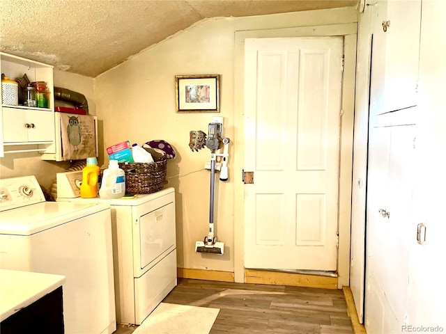 941 French St, Silver Cliff, CO 81252 - washroom featuring cabinet space, independent washer and dryer, light wood-type flooring, and a textured ceiling