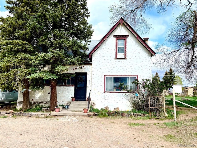 941 French St, Silver Cliff, CO 81252 - view of front of house with entry steps and stucco siding