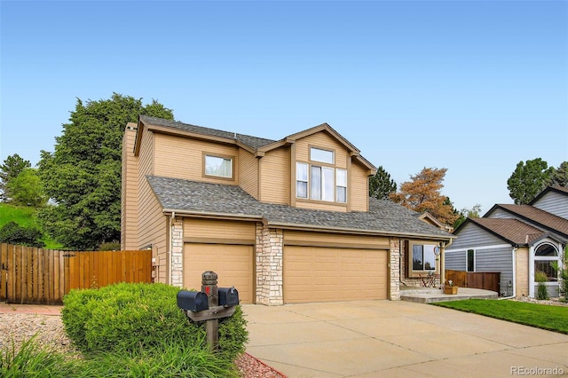 12013 W 56th Cir, Arvada, CO 80002 - traditional-style home featuring an attached garage, driveway, a chimney, and stone siding