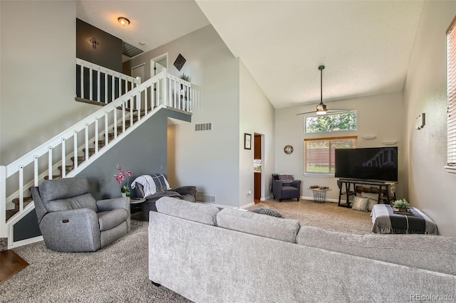 12013 W 56th Cir, Arvada, CO 80002 - carpeted living area featuring stairs, ceiling fan, and high vaulted ceiling