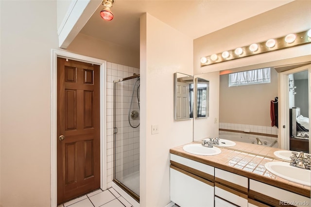 12013 W 56th Cir, Arvada, CO 80002 - bathroom with double vanity, a shower stall, and tile patterned floors