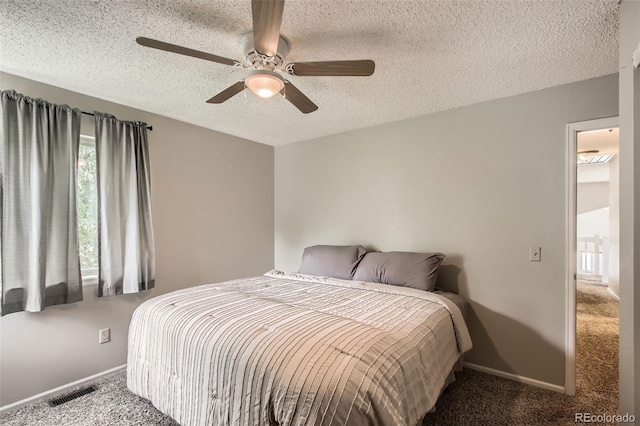 12013 W 56th Cir, Arvada, CO 80002 - carpeted bedroom featuring a textured ceiling and ceiling fan