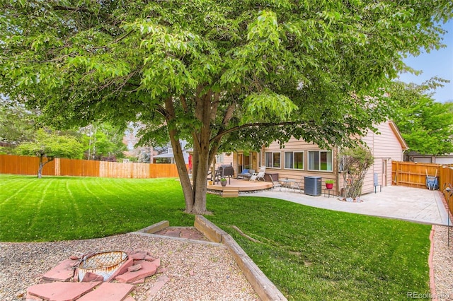 12013 W 56th Cir, Arvada, CO 80002 - fenced backyard with a patio area and a deck