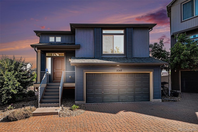5048 N Andes St, Denver, CO 80249 - view of front facade with an attached garage and decorative driveway