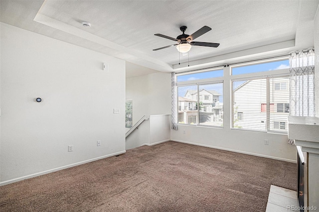 5048 N Andes St, Denver, CO 80249 - carpeted spare room with a raised ceiling, a ceiling fan, and a smoke detector