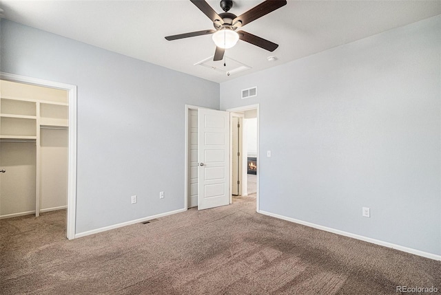 5048 N Andes St, Denver, CO 80249 - unfurnished bedroom featuring carpet flooring, a spacious closet, and ceiling fan