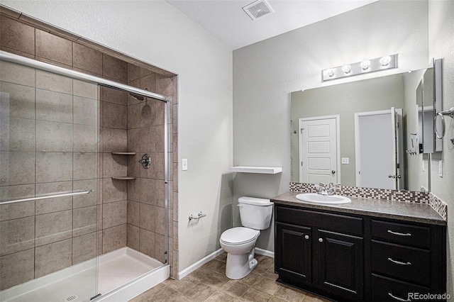 5048 N Andes St, Denver, CO 80249 - bathroom with vanity, a shower stall, and tile patterned flooring