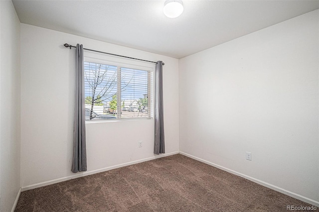 5048 N Andes St, Denver, CO 80249 - carpeted empty room featuring baseboards