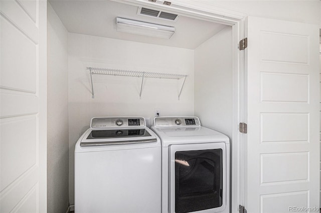 5048 N Andes St, Denver, CO 80249 - laundry room with washer and clothes dryer
