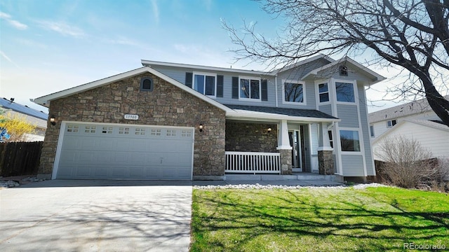 view of front of house with concrete driveway, a porch, stone siding, and a garage
