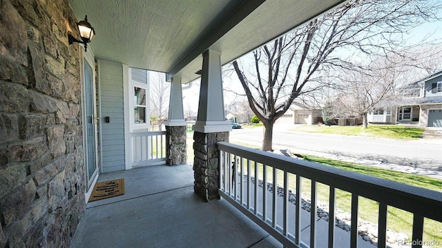 balcony with a residential view and covered porch