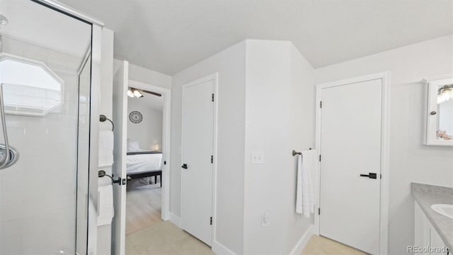 full bathroom featuring ensuite bathroom, a shower stall, and vanity