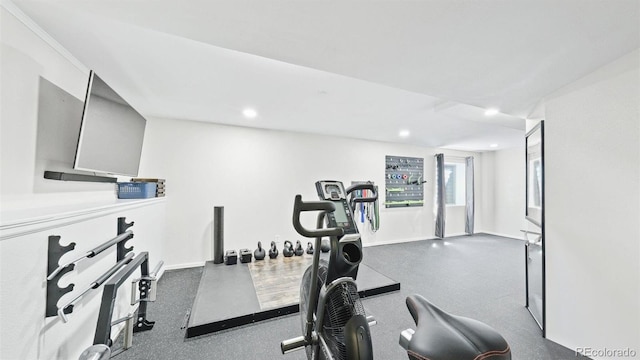 workout area featuring baseboards and recessed lighting