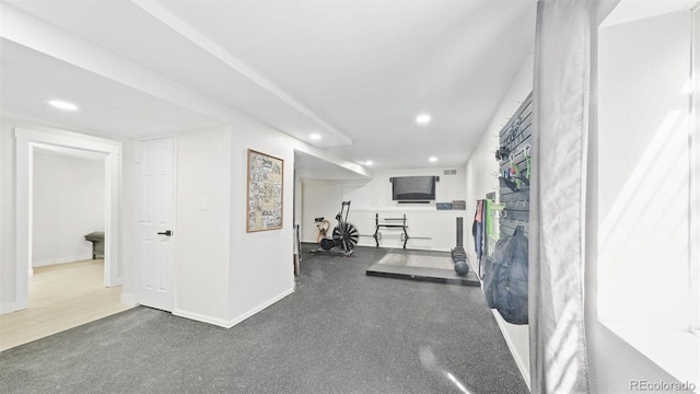exercise area featuring baseboards and recessed lighting
