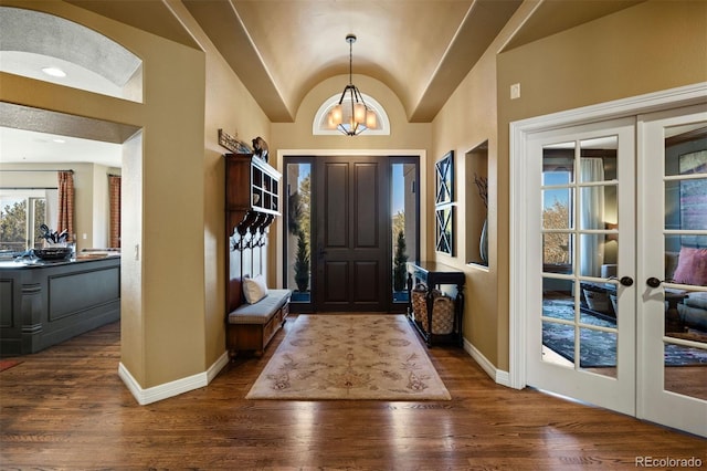 foyer featuring vaulted ceiling, french doors, hardwood / wood-style floors, and baseboards