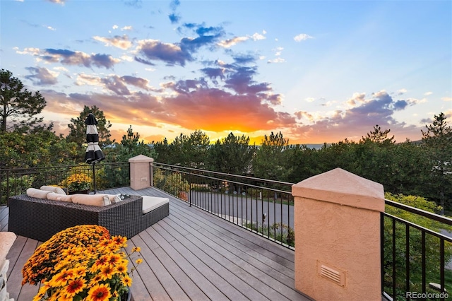 wooden deck with an outdoor living space