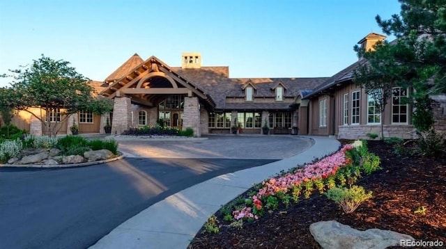 exterior space featuring stone siding