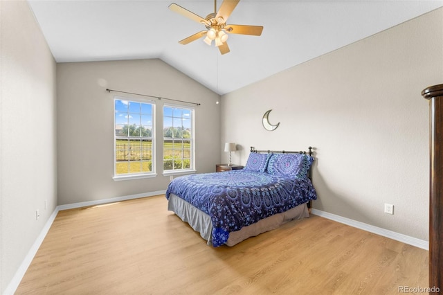 bedroom featuring hardwood / wood-style flooring, lofted ceiling, and ceiling fan