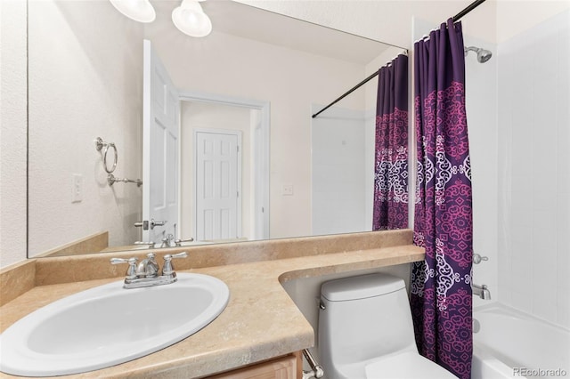 full bathroom with shower / bathtub combination with curtain, vanity, and toilet