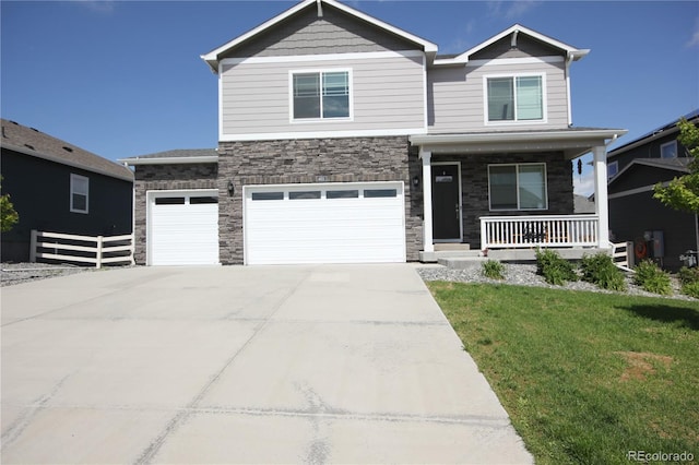 4955 Trails Edge Ln, Castle Rock, CO 80104 - craftsman-style house with a porch, concrete driveway, stone siding, and an attached garage