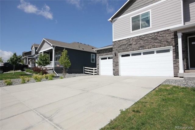 4955 Trails Edge Ln, Castle Rock, CO 80104 - view of side of home featuring stone siding, concrete driveway, and an attached garage