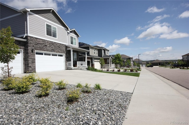 4955 Trails Edge Ln, Castle Rock, CO 80104 - view of front of house featuring a residential view, stone siding, driveway, and a garage