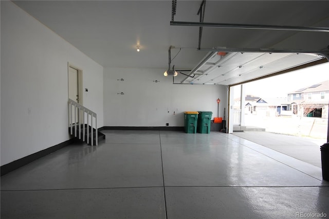 4955 Trails Edge Ln, Castle Rock, CO 80104 - garage with a garage door opener and baseboards