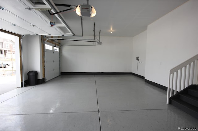 4955 Trails Edge Ln, Castle Rock, CO 80104 - garage with a garage door opener and baseboards
